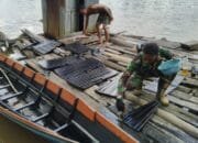Satgas TMMD ke-124 Bantu Warga Cat Perahu di Desa Talio